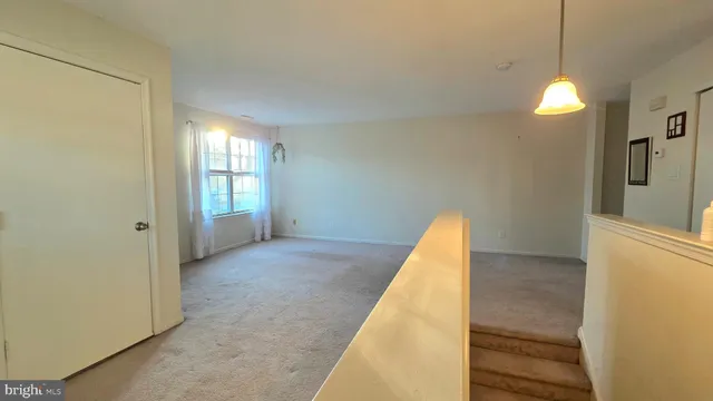 a view of a room with a staircase