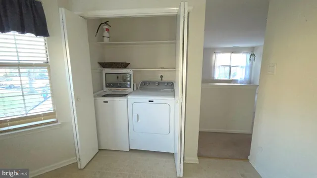 a kitchen with a refrigerator and cabinets