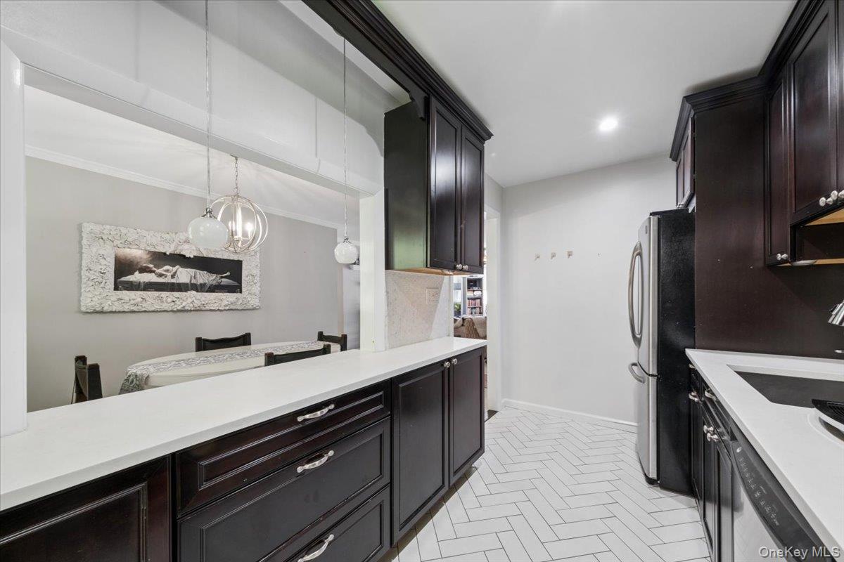 51 Avon Circle, Unit D Rye Brook, NY 10573 - Photo 29 of 30 Kitchen pass-through for easy access to dining room and open floor plan