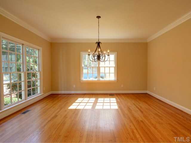 206 Avon Drive Raleigh, NC 27608 - Photo 4 of 12 Light and Bright Formal Dining Room with Hardwood Floors.