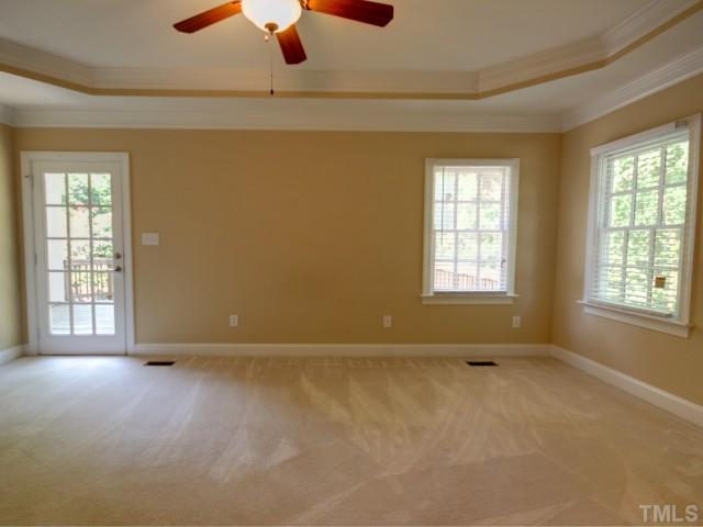 206 Avon Drive Raleigh, NC 27608 - Photo 7 of 12 Accented with a Tray Ceiling, the Master Bedroom has both His and Her Walk-In Closets.