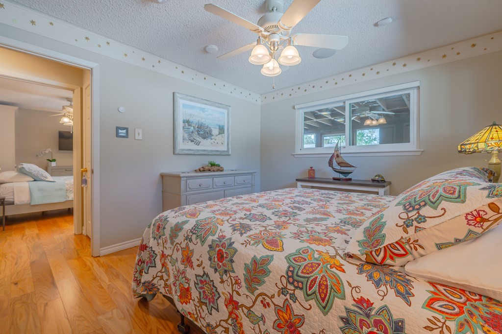 9 Sandra Drive Fulton, TX 78382 - Photo 19 of 35 a bedroom with a bed and wooden floor