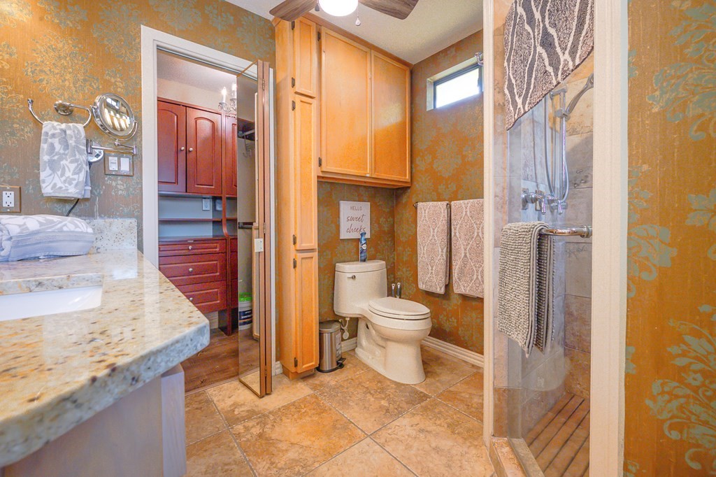 9 Sandra Drive Fulton, TX 78382 - Photo 23 of 35 a bathroom with a granite countertop sink and a mirror
