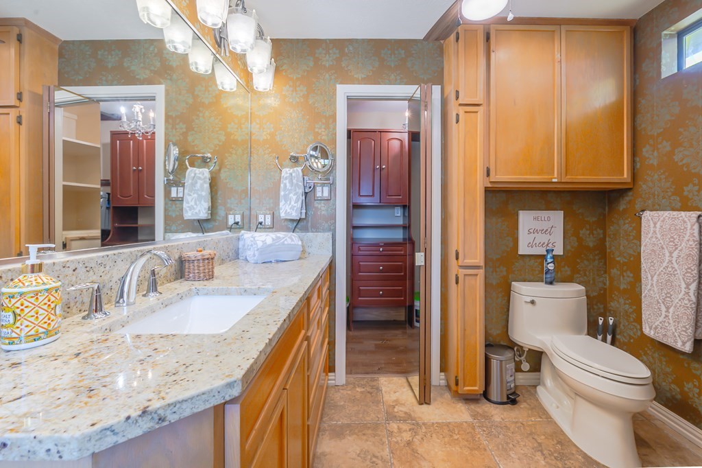 9 Sandra Drive Fulton, TX 78382 - Photo 24 of 35 a bathroom with a granite countertop sink a toilet and shower