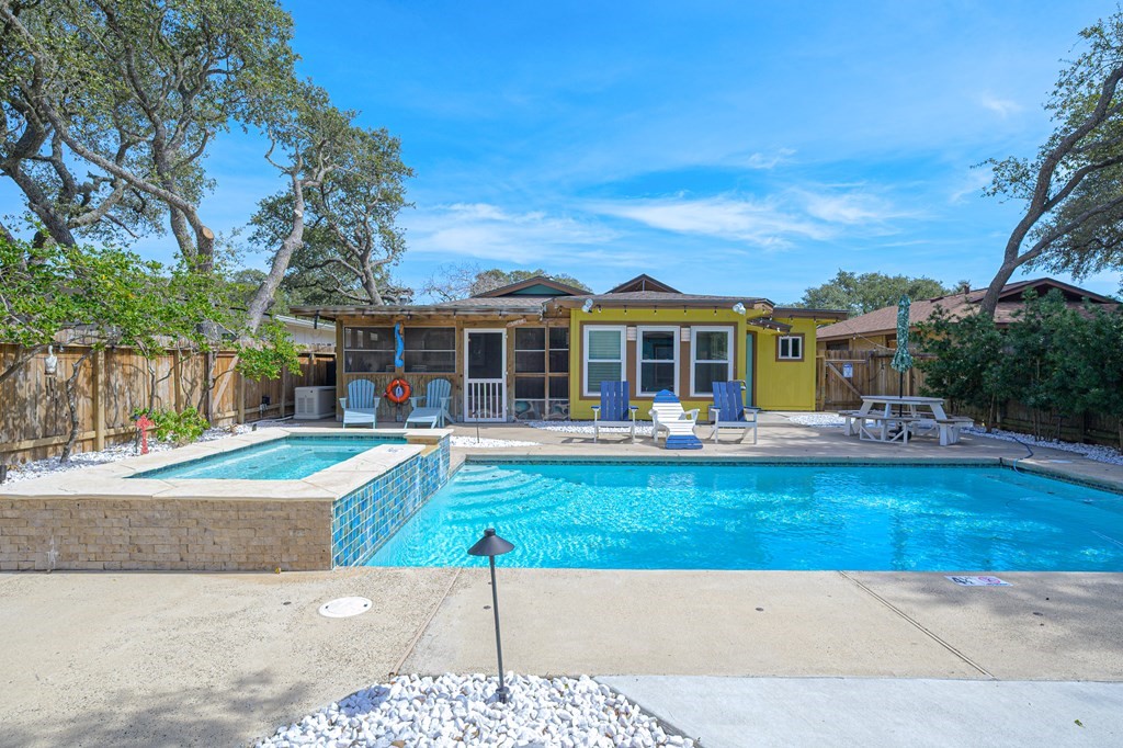 9 Sandra Drive Fulton, TX 78382 - Photo 28 of 35 a front view of a house with swimming pool having outdoor seating