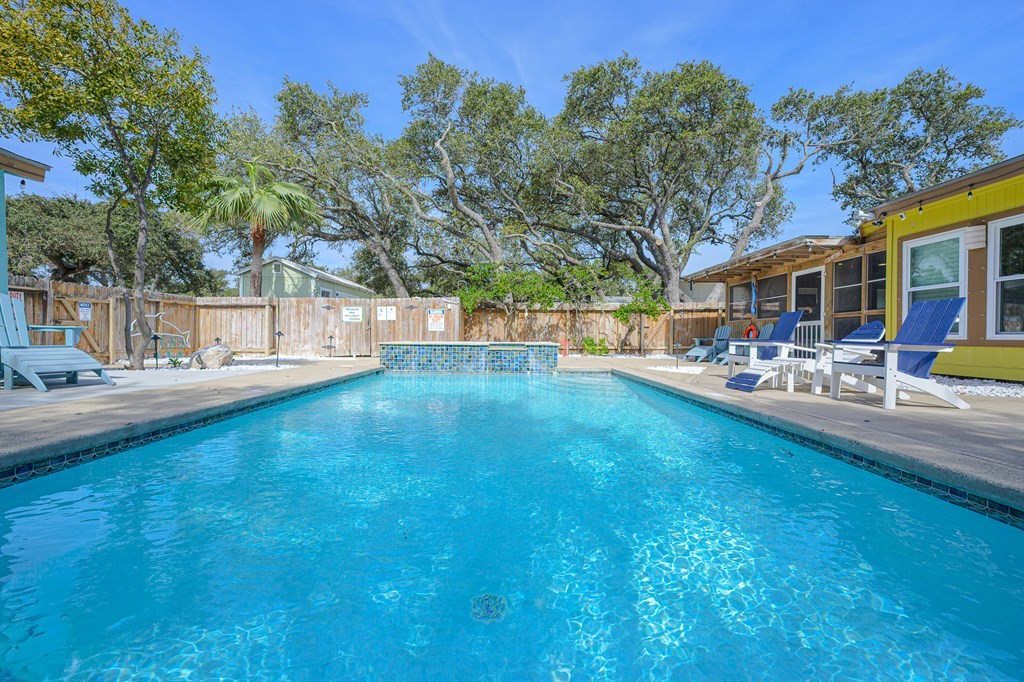 9 Sandra Drive Fulton, TX 78382 - Photo 32 of 35 a swimming pool with outdoor seating and yard