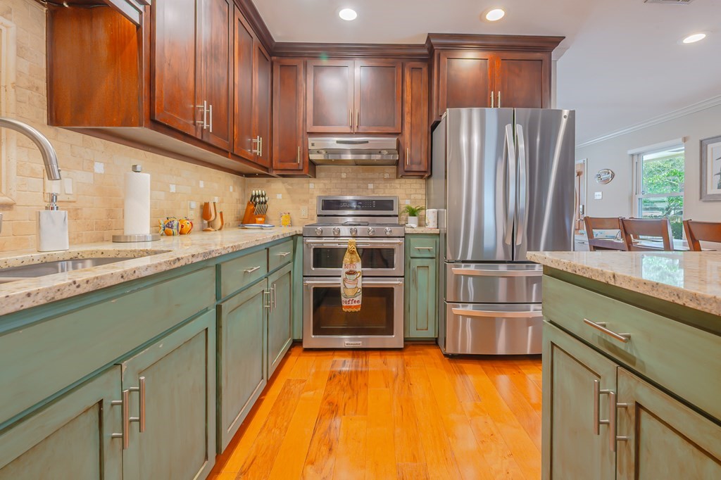 9 Sandra Drive Fulton, TX 78382 - Photo 10 of 35 a kitchen with stainless steel appliances granite countertop a refrigerator a sink and a stove