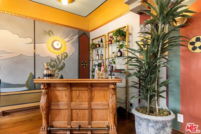 a outdoor space with lots of furniture and wooden floor