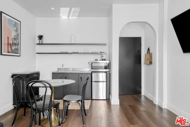 a bathroom with a sink toilet and a window