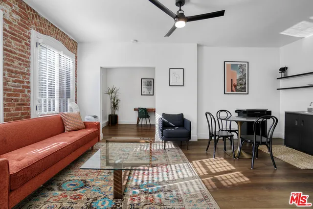 a bedroom with a bed and a chair