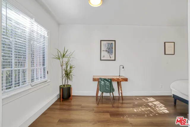 a living room with fireplace furniture and a flat screen tv