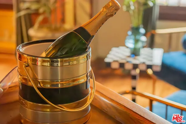 a view of living room with furniture and wooden floor