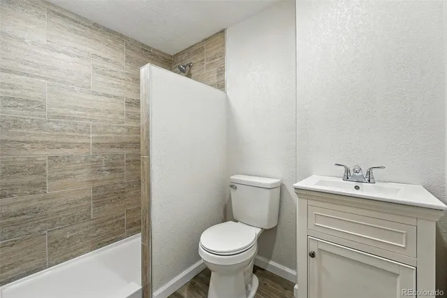 a bathroom with a sink a toilet and a bathtub