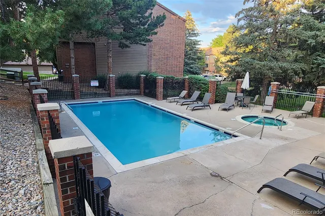 a view of a patio with swimming pool table and chairs