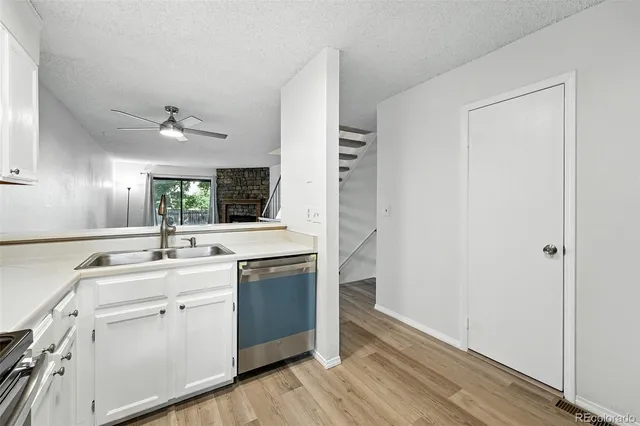a kitchen with a sink and cabinets