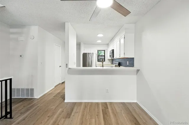 a view of kitchen with wooden floor