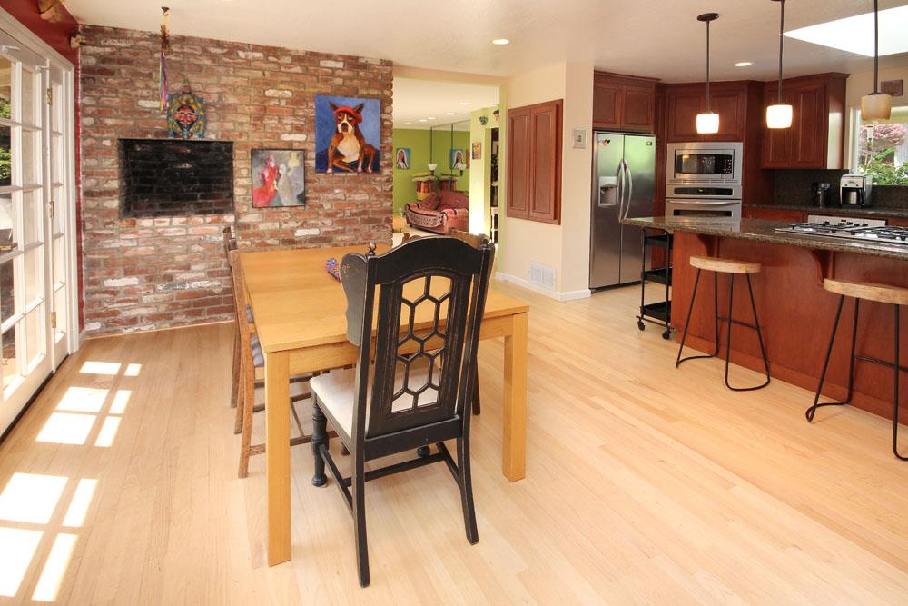 1 Oak Road Santa Cruz, CA 95060 - Photo 14 of 25 a view of a kitchen with kitchen island dining table and chairs