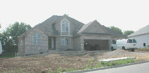 9697 Rambouillet Ridge Roscoe, IL 61073 - Photo 1 of 1 a front view of a house with garden
