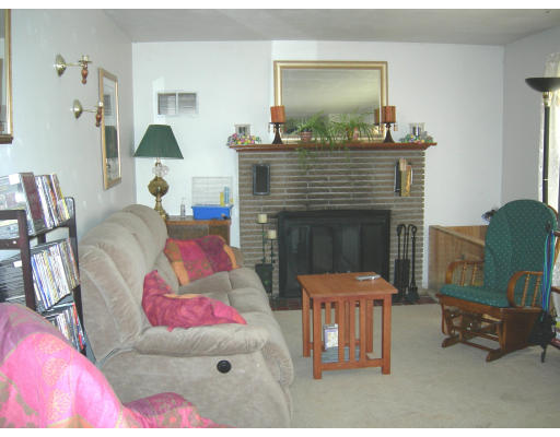 900 Morgan Road West Springfield, MA 01089 - Photo 3 of 10 a living room with furniture and a fireplace