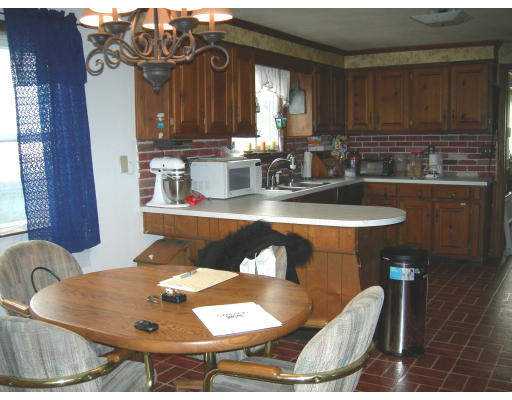 900 Morgan Road West Springfield, MA 01089 - Photo 5 of 10 a kitchen with a table and chairs in it