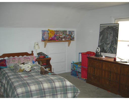 900 Morgan Road West Springfield, MA 01089 - Photo 7 of 10 a bedroom with a bed and dresser