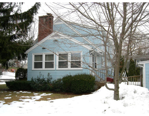 900 Morgan Road West Springfield, MA 01089 - Photo 9 of 10 a front view of a house with a yard covered in snow