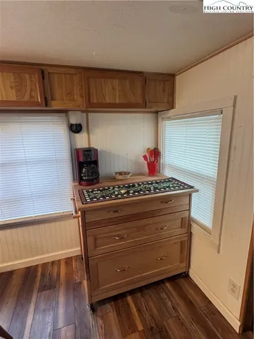 a view of room with wooden floor