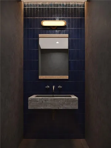 a bathroom with a sink and a mirror