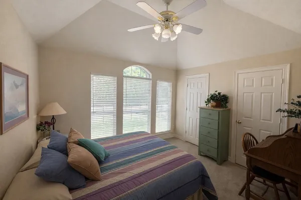 a view of a livingroom with furniture and a window