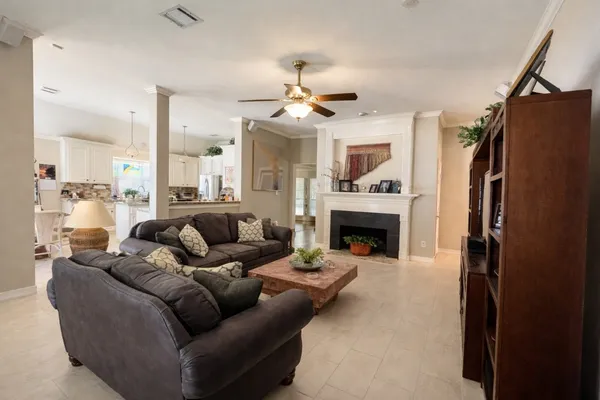 a living room with furniture and a fireplace