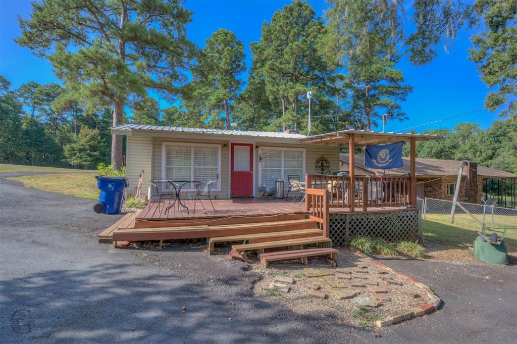459 Dollie Moore Road Ringgold, LA 71068 - Photo 2 of 19 Wood deck with stairs and lattice skirting