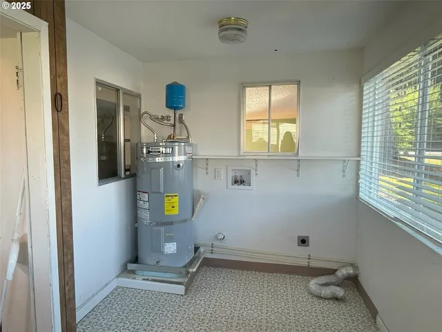 a kitchen with a stove sink and cabinets