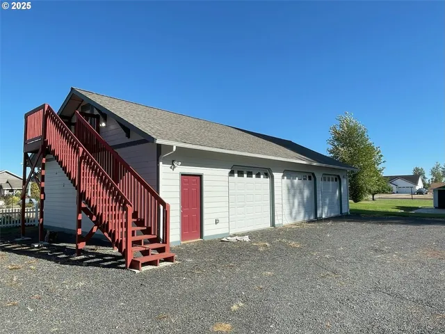 a view of a house with a street