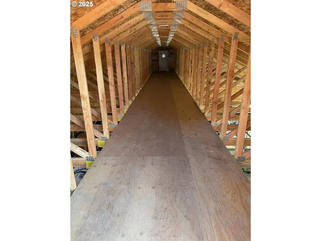 a view of a hallway with stairs