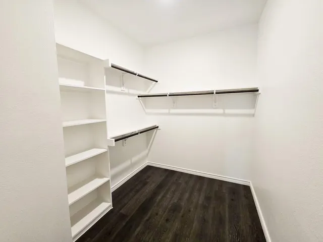 a view of an empty walk in closet