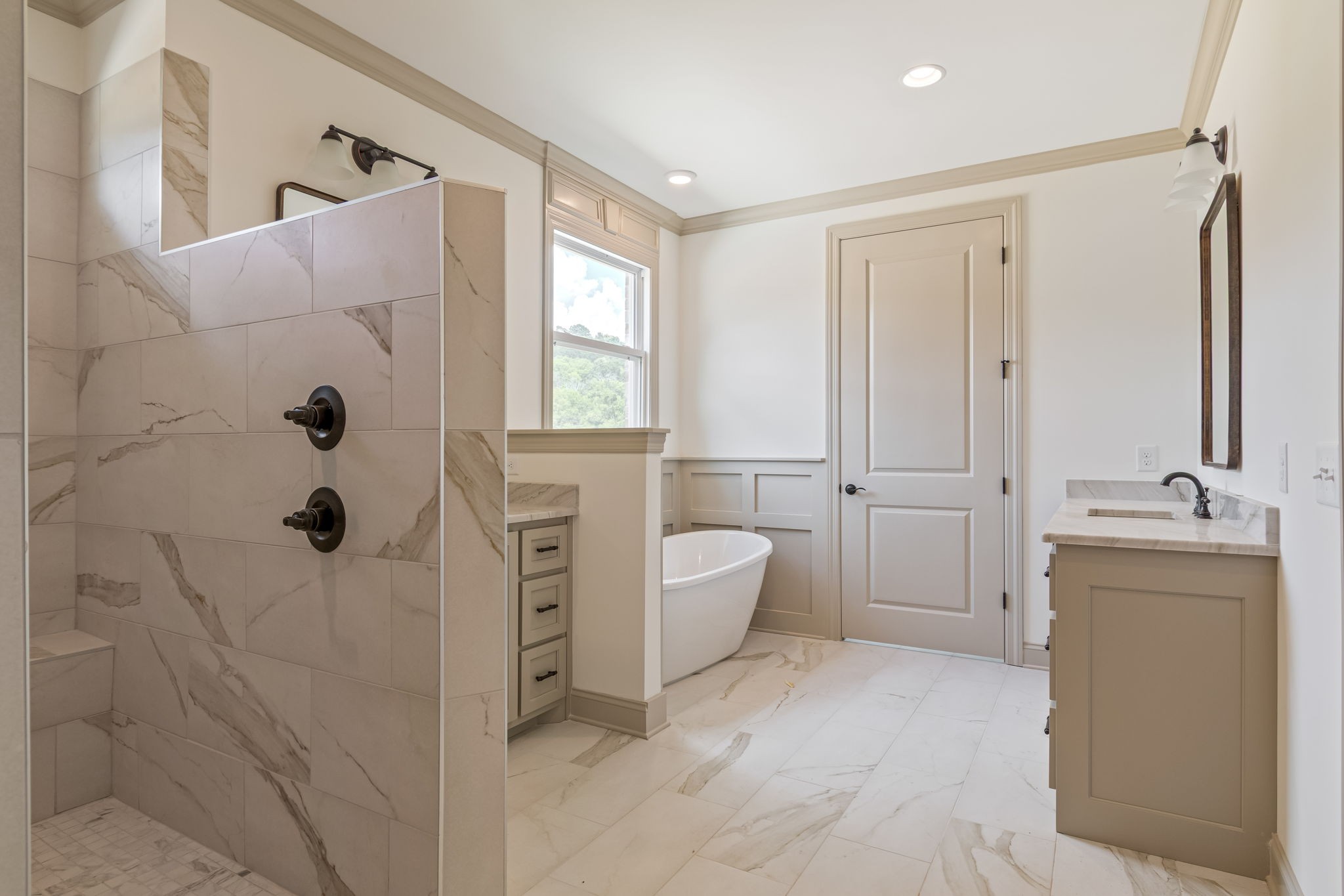 4049 Advocate Path Culleoka, TN 38451 - Photo 15 of 25 a bathroom with a tub sink and mirror