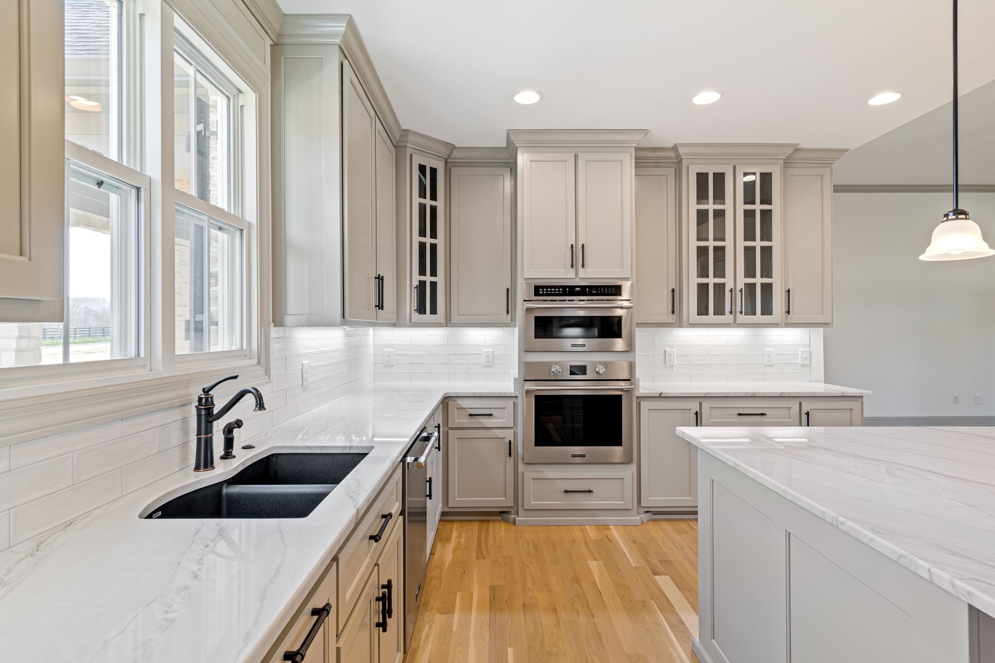 4049 Advocate Path Culleoka, TN 38451 - Photo 6 of 25 a kitchen with white cabinets sink and stainless steel appliances