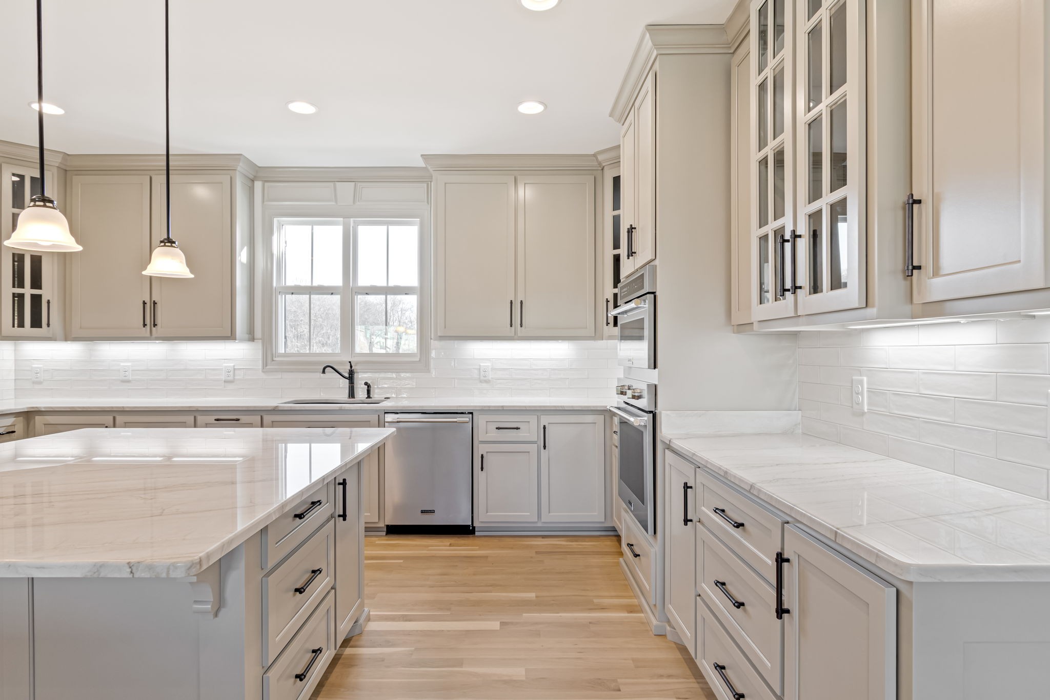 4049 Advocate Path Culleoka, TN 38451 - Photo 8 of 25 a kitchen with granite countertop a sink stove and cabinets