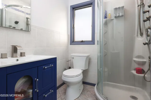 a view of a kitchen with a stove and wooden floor