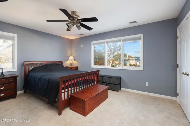 a view of a house with a yard and roof