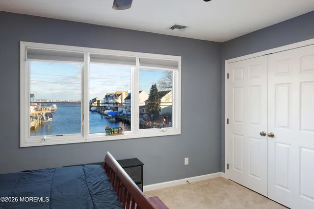 a view of a house with a wooden fence