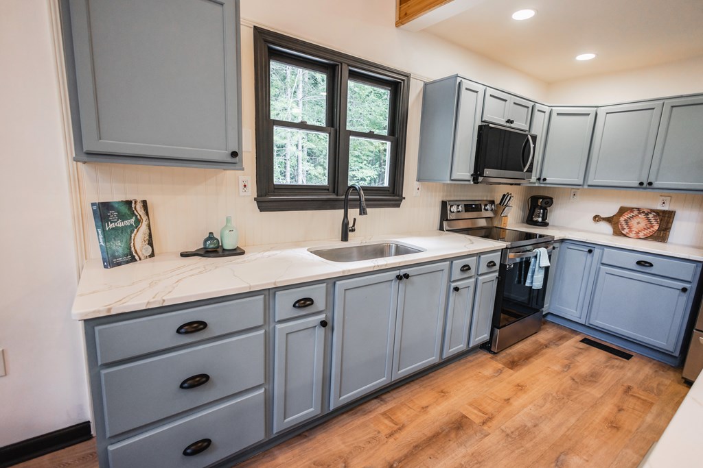 2 Watson Gap Road Mineral Bluff, GA 30559 - Photo 23 of 80 a kitchen with a sink stove and microwave
