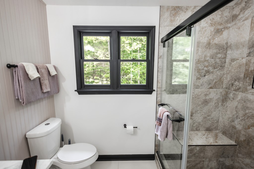 2 Watson Gap Road Mineral Bluff, GA 30559 - Photo 50 of 80 a white toilet sitting next to a bathroom sink