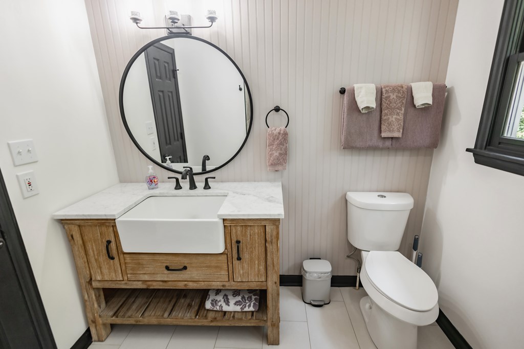 2 Watson Gap Road Mineral Bluff, GA 30559 - Photo 51 of 80 a bathroom with a toilet a sink and a mirror