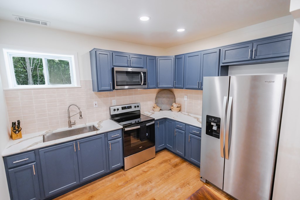 2 Watson Gap Road Mineral Bluff, GA 30559 - Photo 63 of 80 a kitchen with granite countertop stainless steel appliances a refrigerator stove top oven and sink