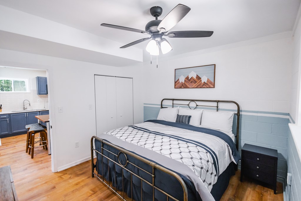 2 Watson Gap Road Mineral Bluff, GA 30559 - Photo 65 of 80 a bedroom with a bed and a chandelier