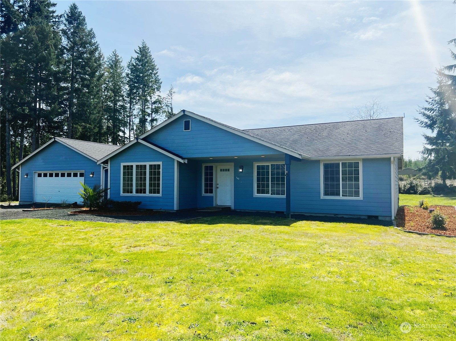 742 East Thornton Road Shelton, WA 98584 - Photo 2 of 39 a front view of house with yard and swimming pool