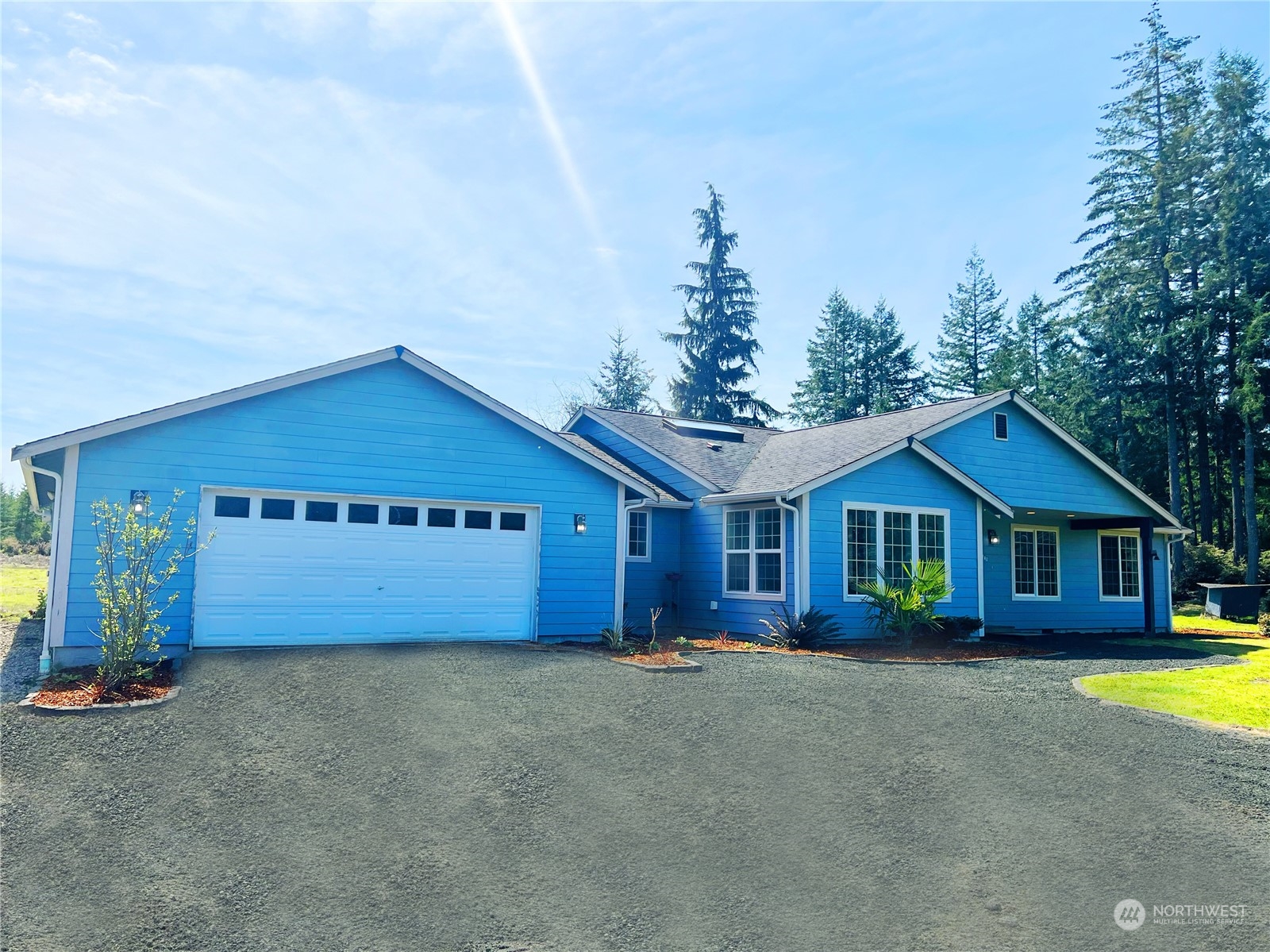 742 East Thornton Road Shelton, WA 98584 - Photo 4 of 39 a front view of a house with a garden and yard