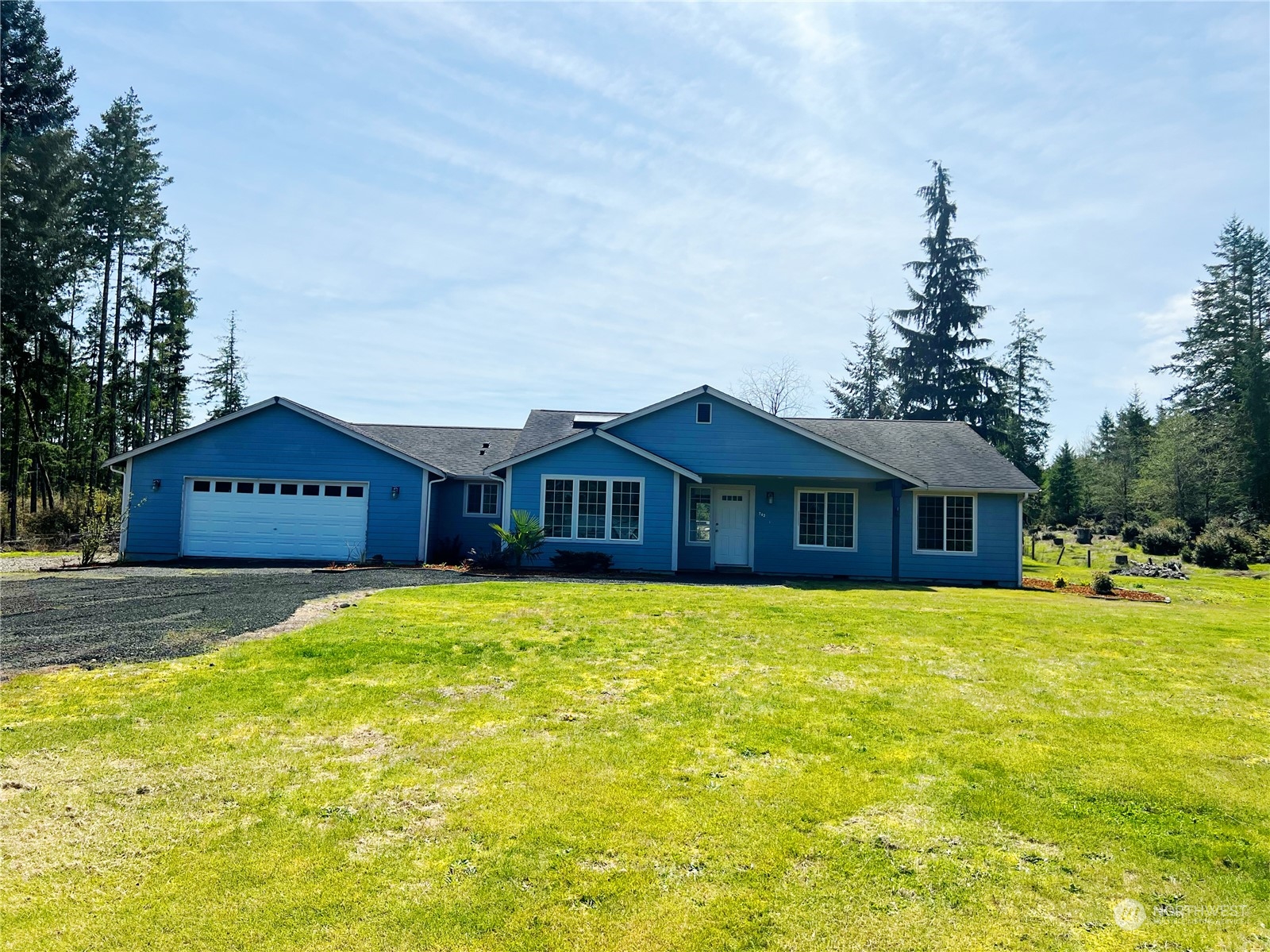 742 East Thornton Road Shelton, WA 98584 - Photo 7 of 39 a large house with a big yard and large trees