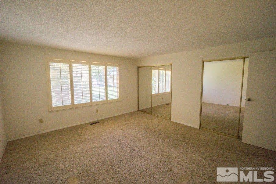 14045 Chamy Drive Reno, NV 89521 - Photo 12 of 25 an empty room with windows